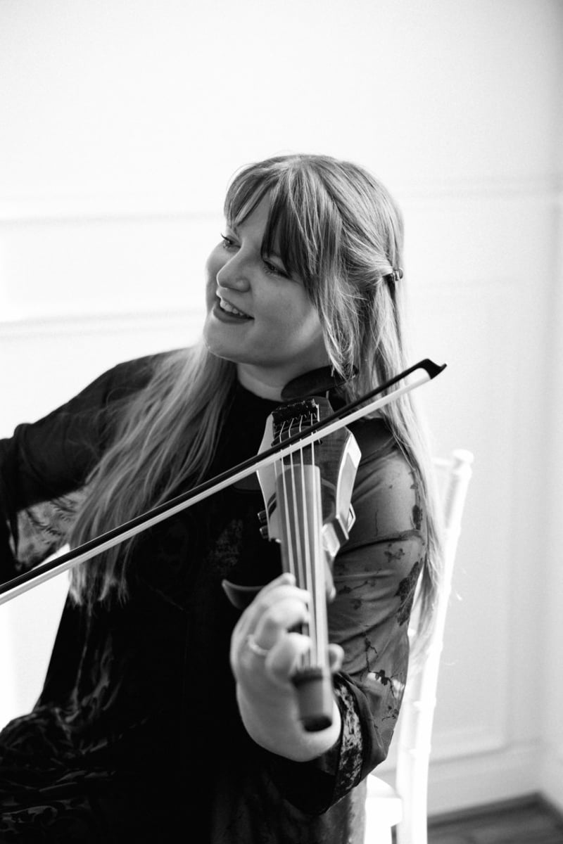 Ana Done performing violin for an intimate elegant event