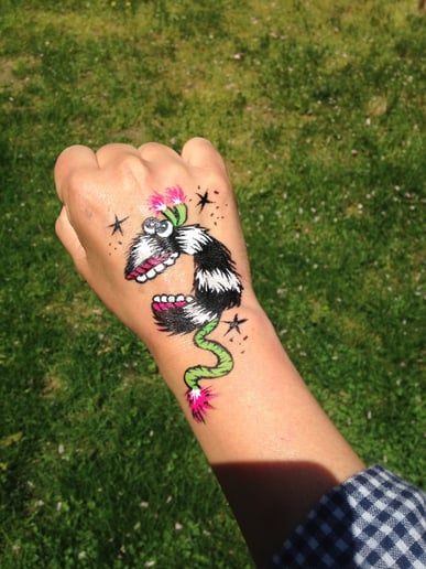 Gallery photo 1 of Color Pop Face Painting & Glitter Tattoo's