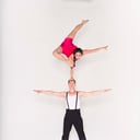 Duo hand balancing , aerialist as well .